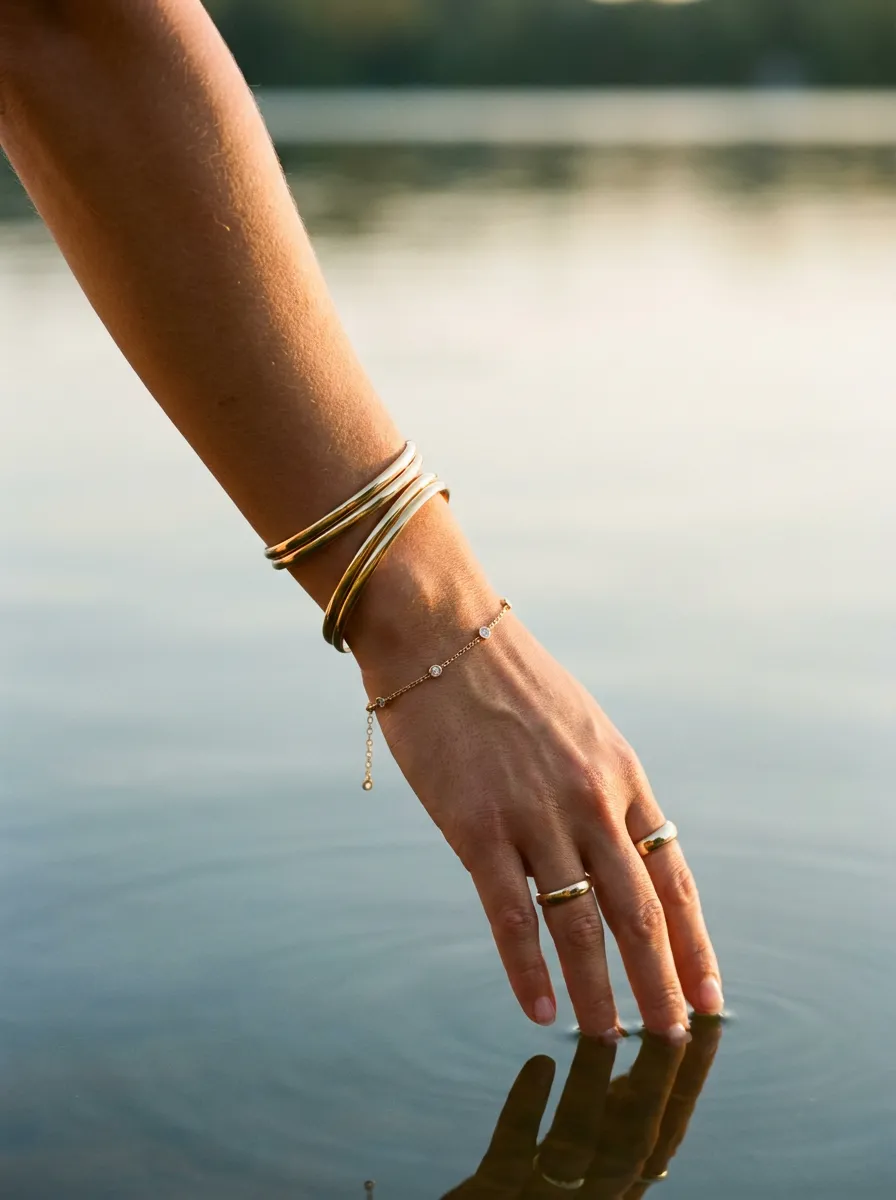 Gold bangles lake water lifestyle image
