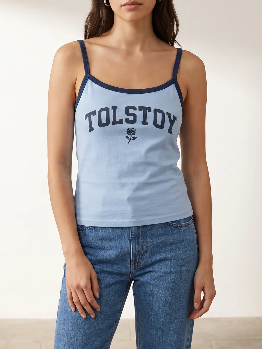 On-model direction for a light blue tank with navy trim