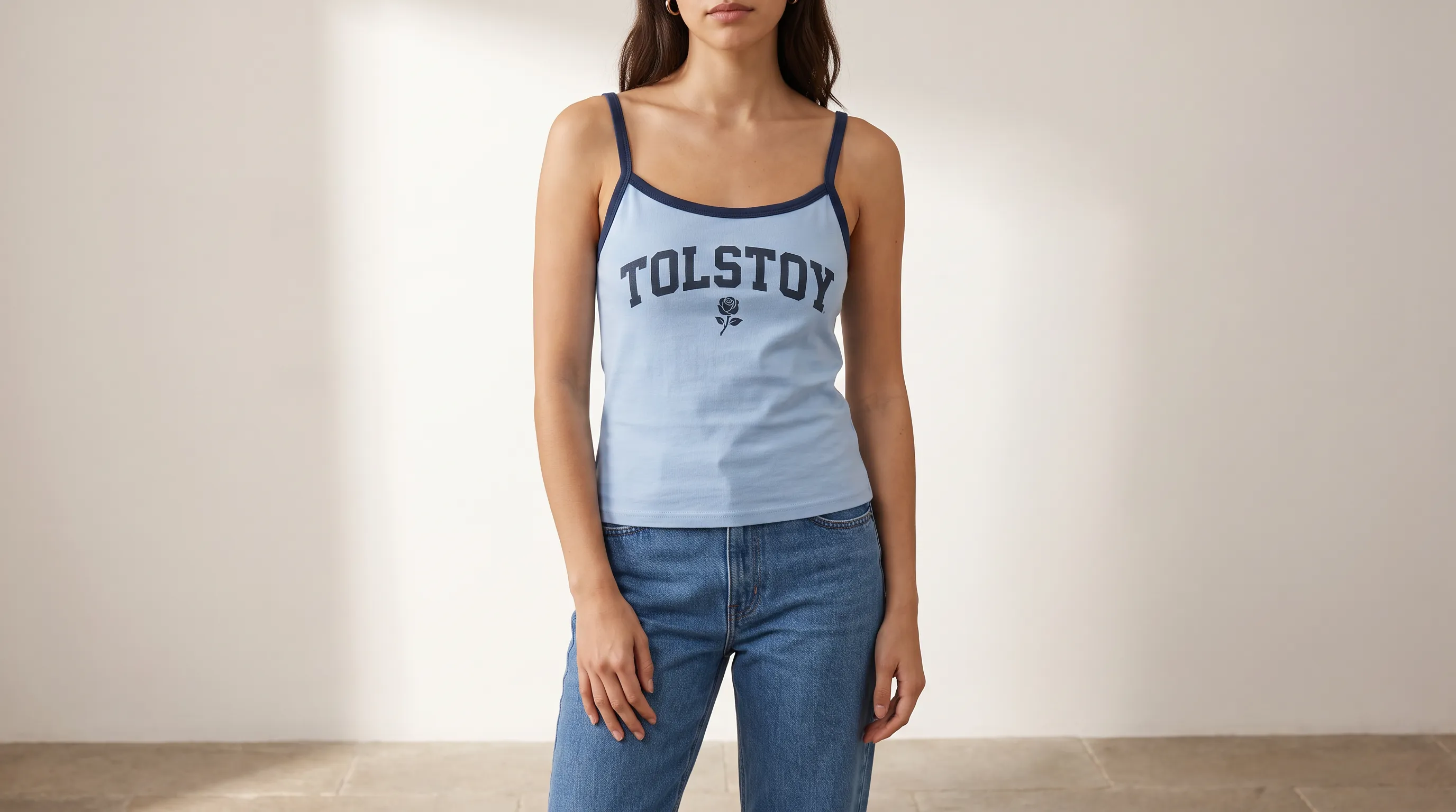On-model studio image of a light blue Tolstoy tank with navy trim